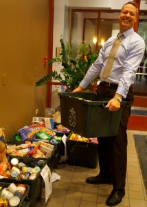 Peter carries out the food bin for the GR Food Drive